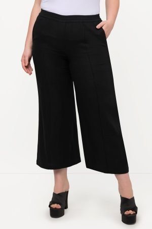 juodos placios lininies kelnes moterims