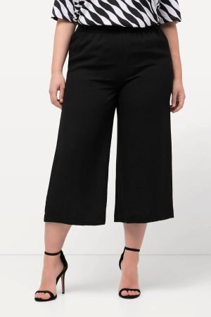 moteriskos juodos placios kelnes